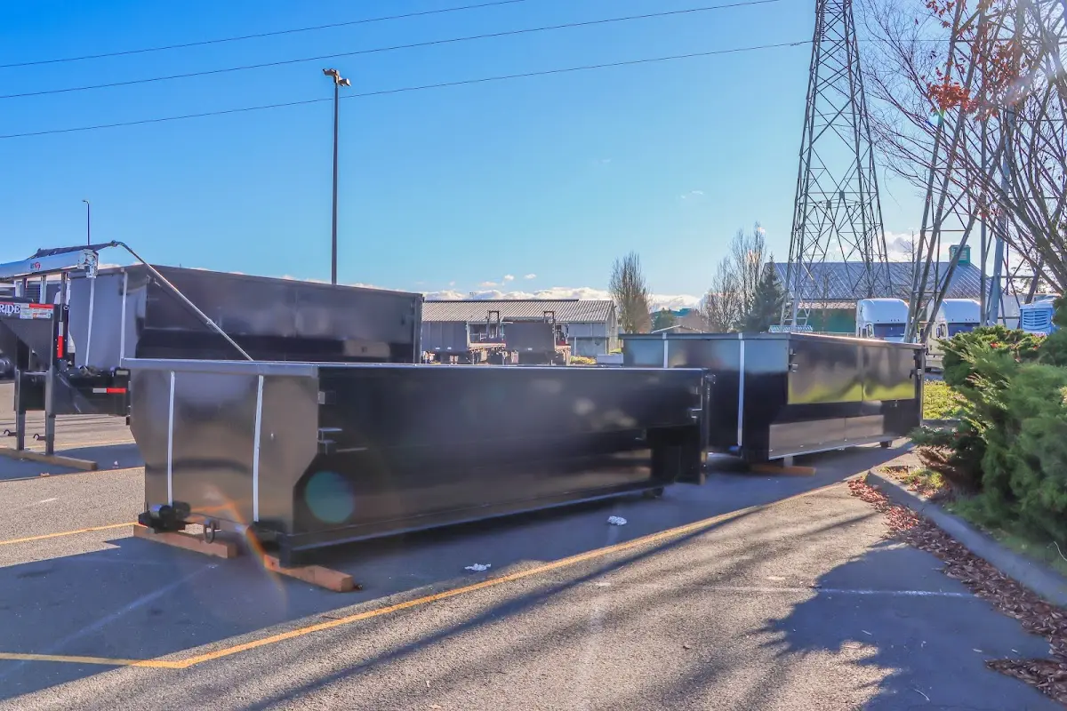 Roll-off dumpster ready for waste disposal at job site for 2 Yard Dumpster Rental in Rexburg